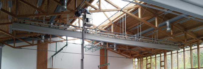 Aerial work platform as a passenger lift in use for the maintenance of stage lighting in sports halls
